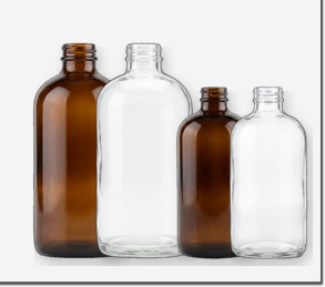 Boston Round glass bottles in amber and flint glass